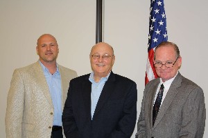 Phil Strauss (l), stakeholder liaison officer, Federal Emergency Management Agency (FEMA), and Jeff Hill (r), chief information technology officer, FEMA, join with Mitch Able, chapter president, at the March meeting.
